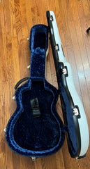 Blue interior of Calton flight case for Martin OM guitar
