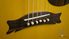 Hewett quilted Mahogany D guitar bridge