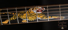 Leach guitar with tiger fretboard inlay