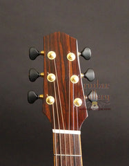 Mustapick OM Fan Fret cutaway guitar headstock