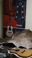 Olson guitar in front of Olson guitar art